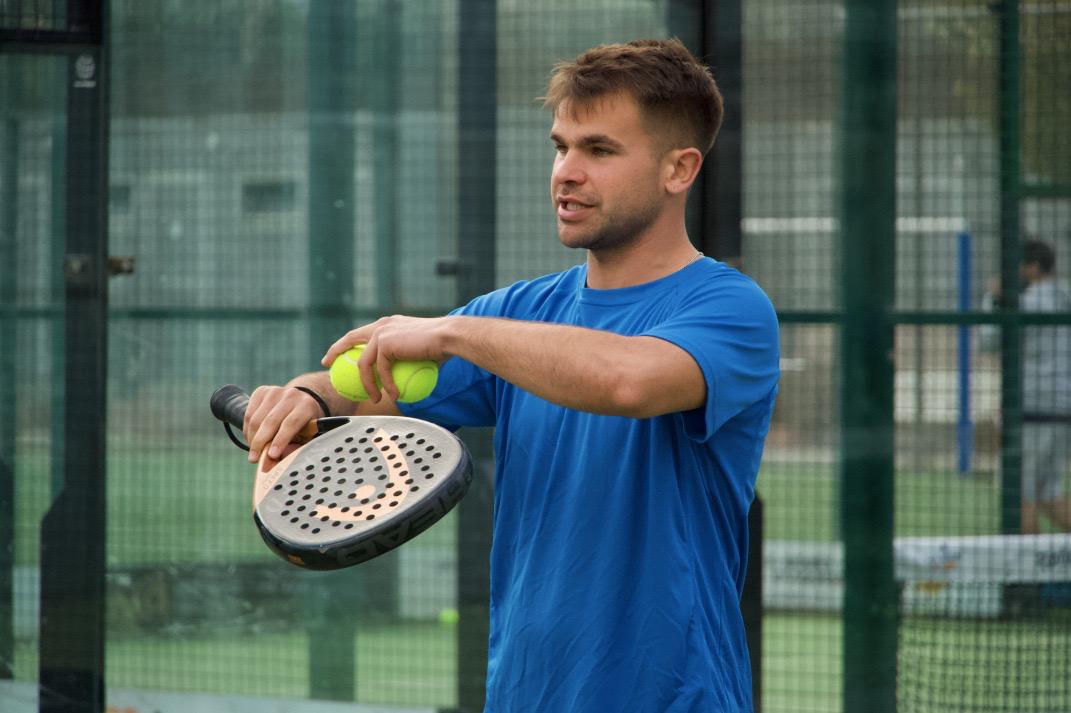 Max, head coach at Barcelona Padel Escapes, preparing to serve