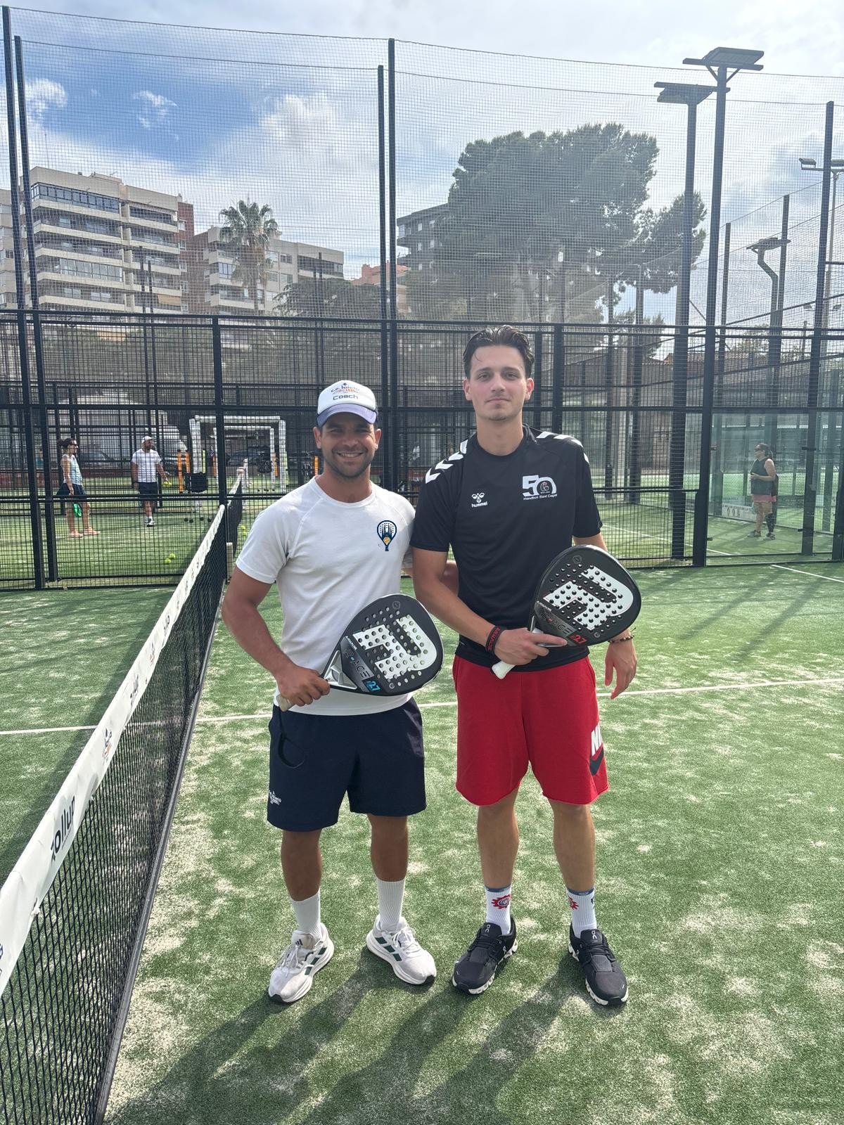 Group of padel players on court